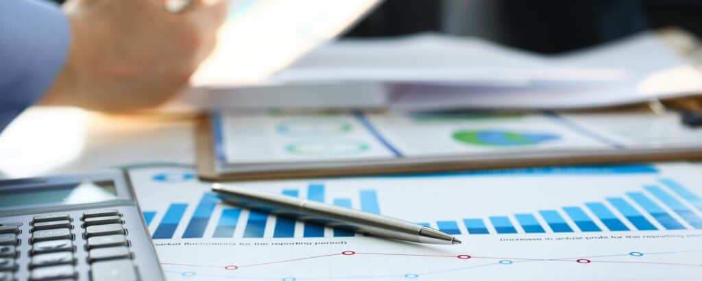 financial documents with bar and line graphs