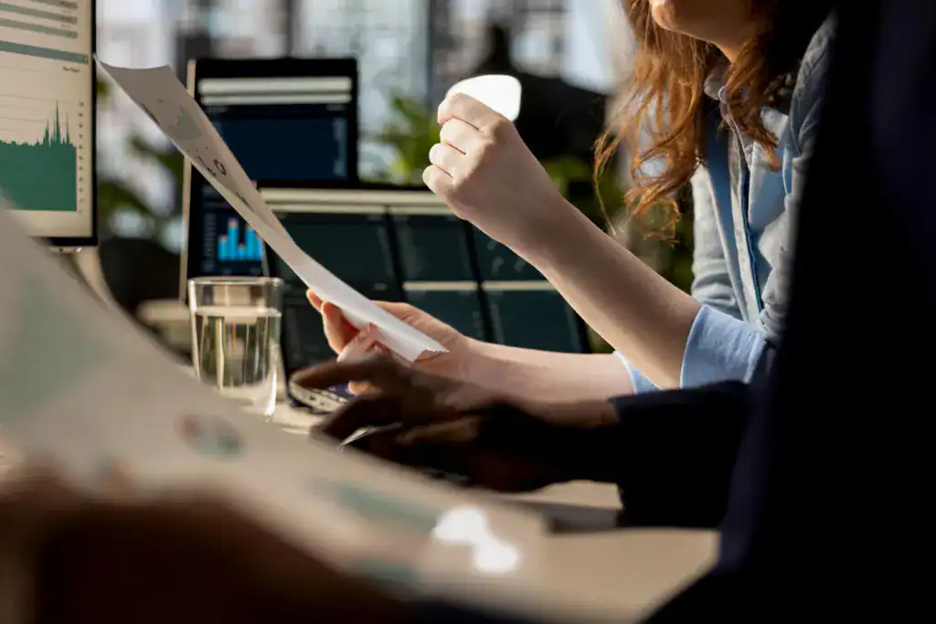 Business professional reviewing performance reports and analytics data to support strategic decision-making