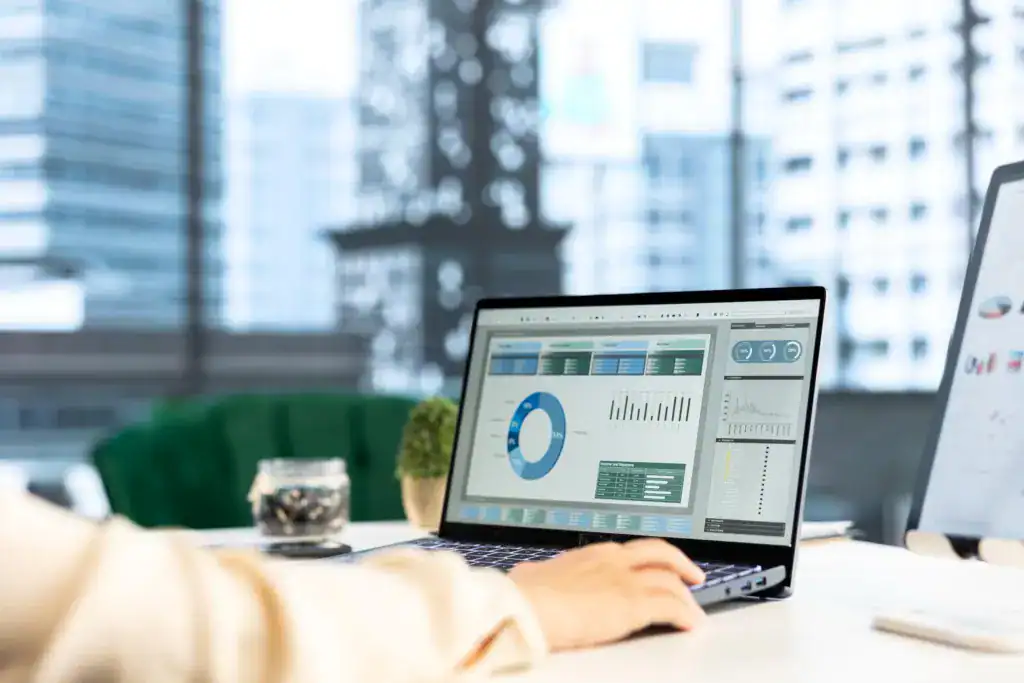 Business intelligence dashboard displayed on a laptop showing reporting and performance metrics
