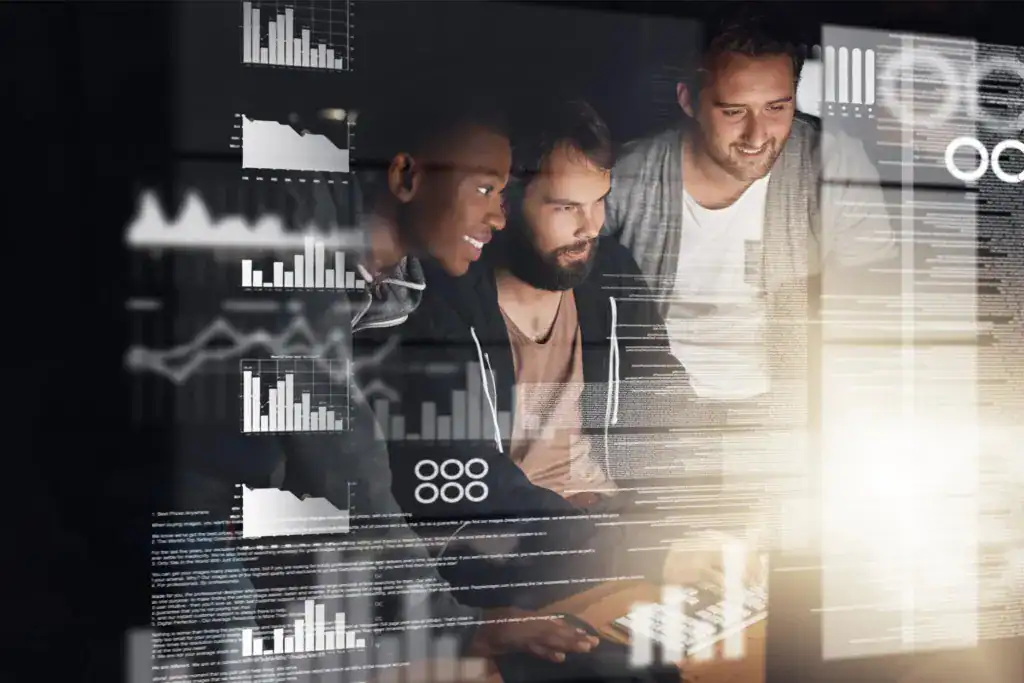 Team reviewing business intelligence dashboards and analytics data on multiple digital screens
