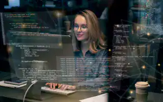 Software developer working on data and analytics applications using computer code.