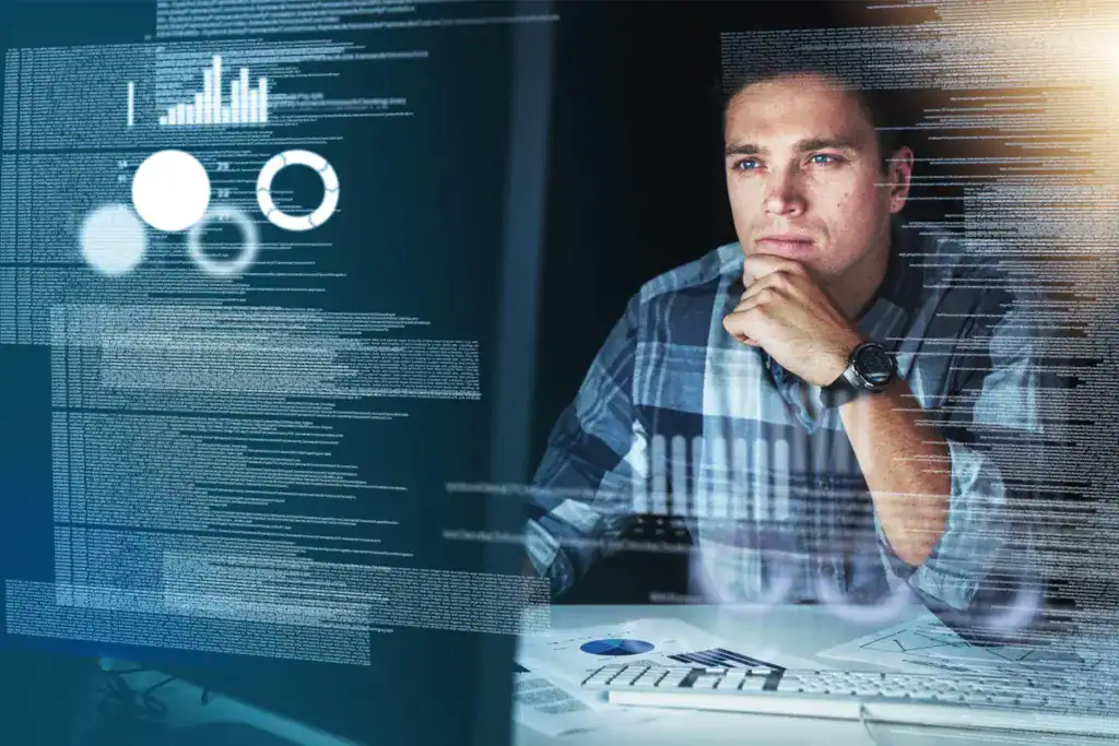 Data professional analysing information and charts on a computer